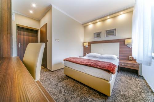 Imagen de la habitación del Hotel Promien. Foto 7