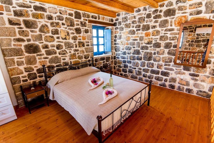 Imagen de la habitación del Hotel Pserimos Villas. Foto 18