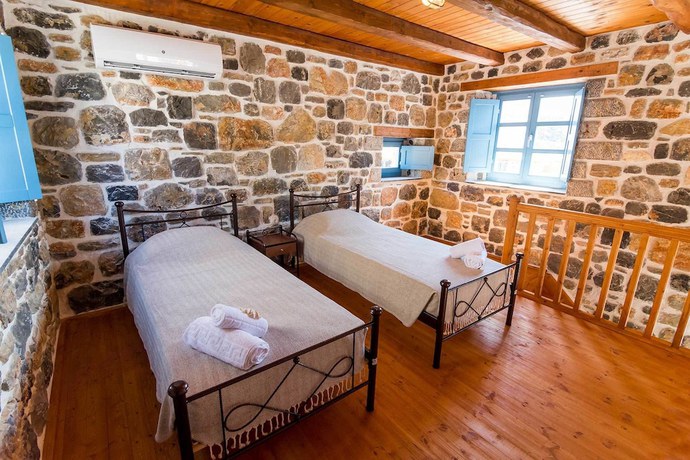 Imagen de la habitación del Hotel Pserimos Villas. Foto 19