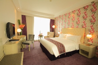 Imagen de la habitación del Hotel Pudong International Talent City Hotel. Foto 10