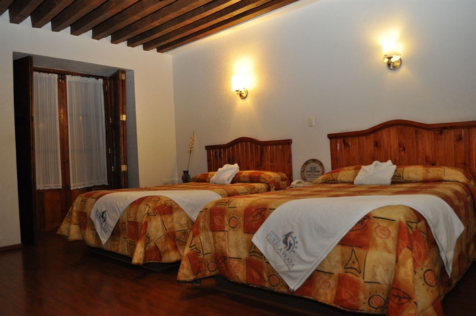 Imagen de la habitación del Hotel Puebla Plaza. Foto 9