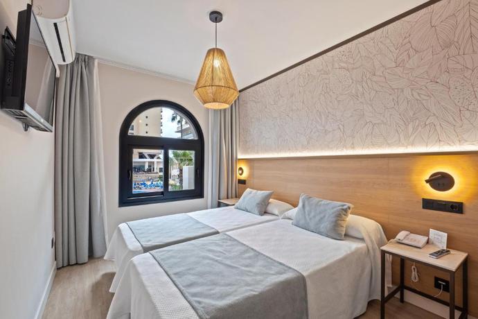 Imagen de la habitación del Hotel Puente Real. Foto 10