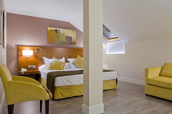 Imagen de la habitación del Hotel Puerta De Toledo. Foto 10