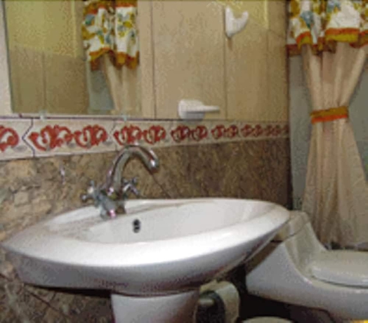 Imagen de la habitación del Hotel Puerta Del Sol, Baños. Foto 14