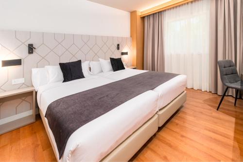 Imagen de la habitación del Hotel Puerta Santander. Foto 3