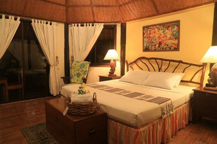 Imagen de la habitación del Hotel Puerto Del Sol Beach Resort. Foto 14