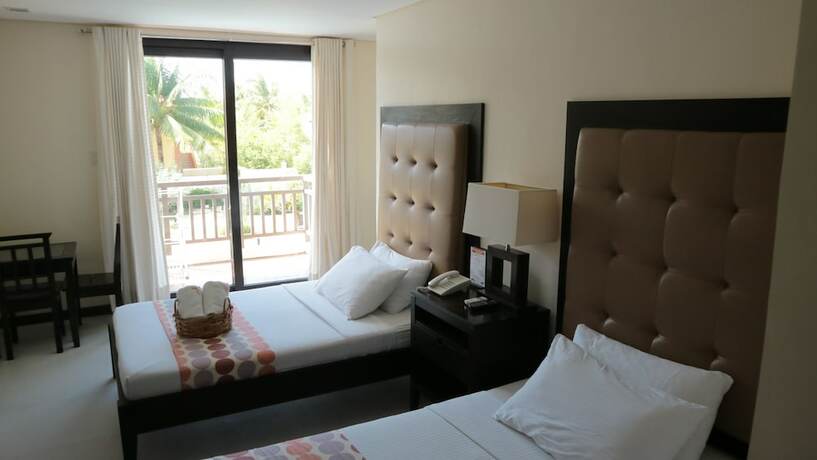 Imagen de la habitación del Hotel Puerto Del Sol Beach Resort. Foto 15