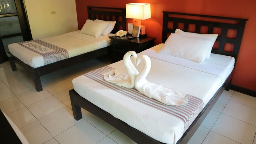 Imagen de la habitación del Hotel Puerto Del Sol Beach Resort. Foto 16