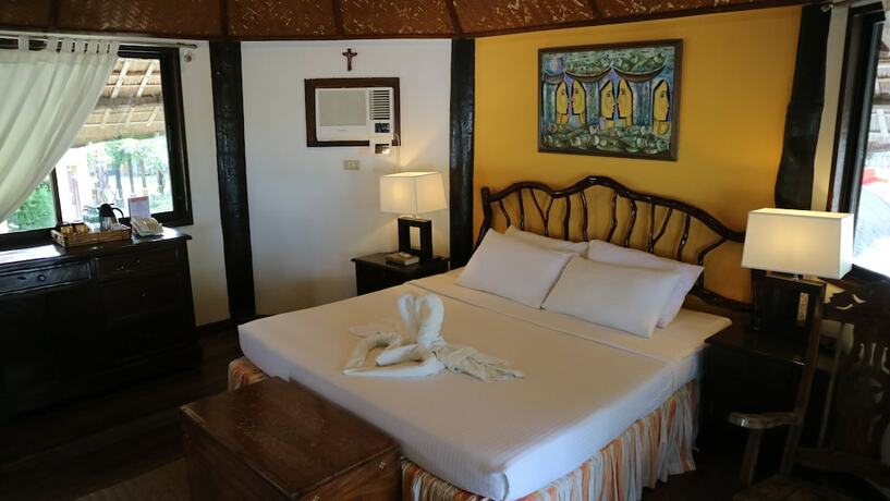 Imagen de la habitación del Hotel Puerto Del Sol Beach Resort. Foto 18