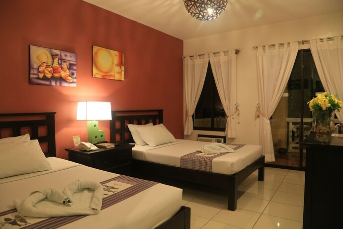 Imagen de la habitación del Hotel Puerto Del Sol Beach Resort. Foto 24