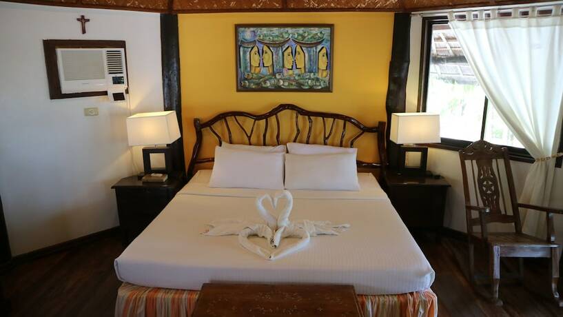 Imagen de la habitación del Hotel Puerto Del Sol Beach Resort. Foto 25
