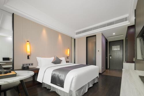 Imagen de la habitación del Hotel Puhui Tianchen Xiamen. Foto 14