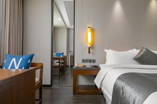 Imagen de la habitación del Hotel Puhui Tianchen Xiamen. Foto 15