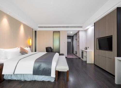 Imagen de la habitación del Hotel Puhui Tianchen Xiamen. Foto 17