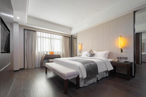 Imagen de la habitación del Hotel Puhui Tianchen Xiamen. Foto 18