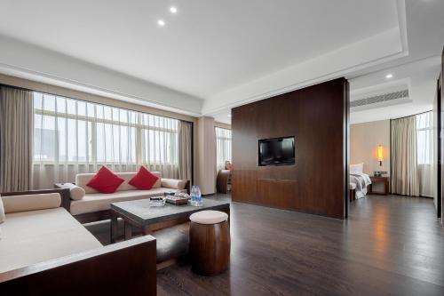 Imagen de la habitación del Hotel Puhui Tianchen Xiamen. Foto 19