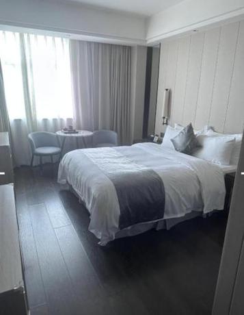 Imagen de la habitación del Hotel Puhui Tianchen Xiamen. Foto 20