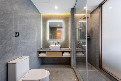 Imagen de la habitación del Hotel Pujue International. Foto 17