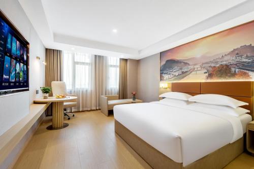 Imagen de la habitación del Hotel Pujue International. Foto 18