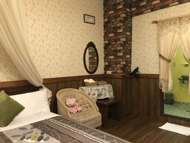 Imagen de la habitación del Hotel Puli Town Bed and Breakfast. Foto 13