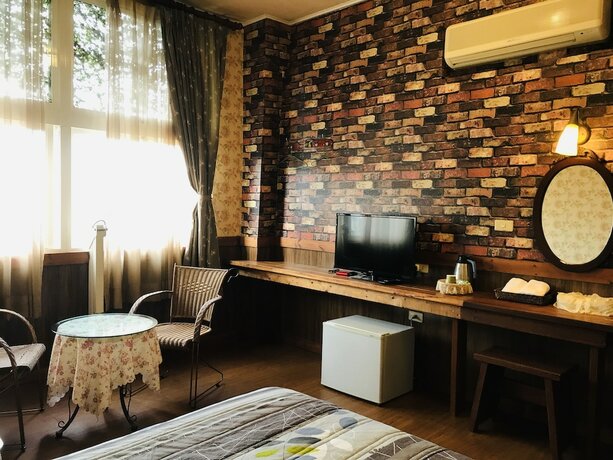 Imagen de la habitación del Hotel Puli Town Bed and Breakfast. Foto 18