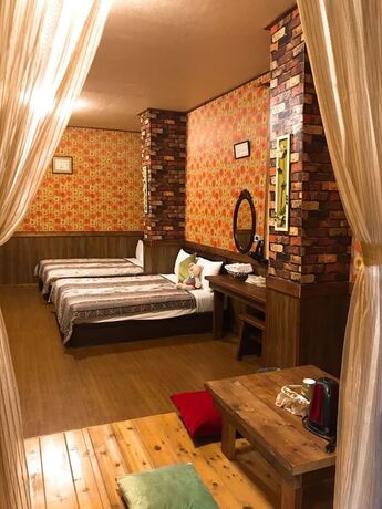 Imagen de la habitación del Hotel Puli Town Bed and Breakfast. Foto 22