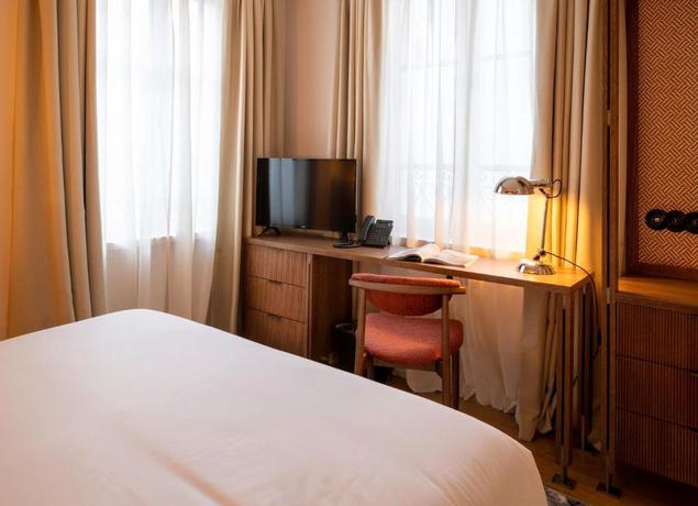 Imagen de la habitación del Hotel Pulitzer Paris. Foto 12
