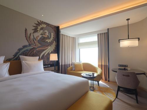 Imagen de la habitación del Hotel Pullman Bandung Grand Central. Foto 8