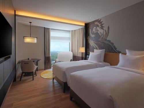Imagen de la habitación del Hotel Pullman Bandung Grand Central. Foto 15