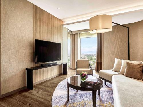 Imagen de la habitación del Hotel Pullman Bandung Grand Central. Foto 19