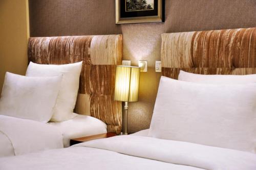 Imagen de la habitación del Hotel Pullman Beijing South. Foto 3