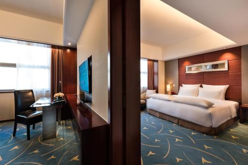Imagen de la habitación del Hotel Pullman Beijing South. Foto 7