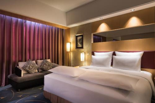 Imagen de la habitación del Hotel Pullman Beijing South. Foto 8