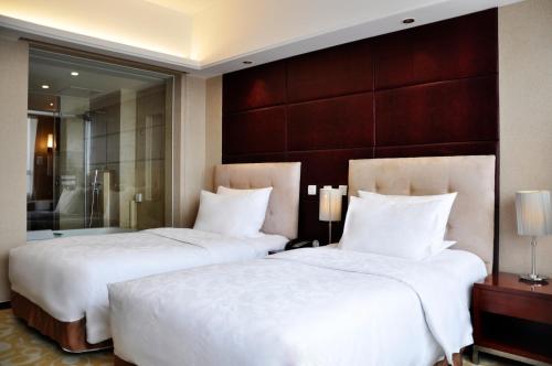 Imagen de la habitación del Hotel Pullman Beijing South. Foto 11