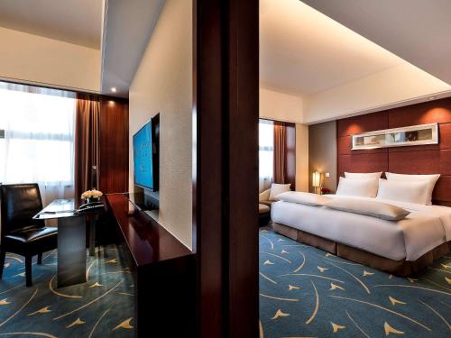 Imagen de la habitación del Hotel Pullman Beijing South. Foto 13