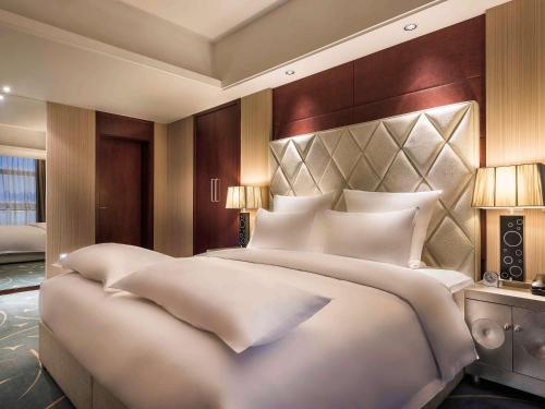 Imagen de la habitación del Hotel Pullman Beijing South. Foto 19