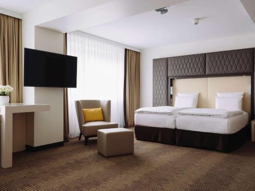 Imagen de la habitación del Hotel Pullman Berlin Schweizerhof. Foto 13