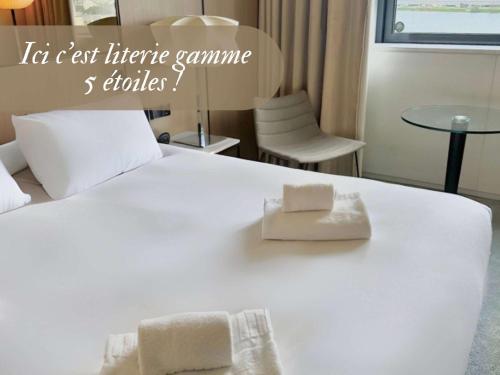 Imagen de la habitación del Hotel Pullman Bordeaux Lac. Foto 13