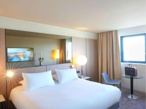 Imagen de la habitación del Hotel Pullman Bordeaux Lac. Foto 16