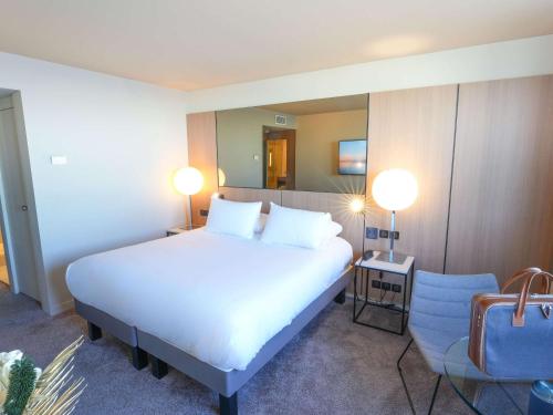 Imagen de la habitación del Hotel Pullman Bordeaux Lac. Foto 19