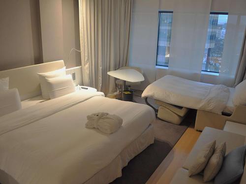 Imagen de la habitación del Hotel Pullman Brussels Centre Midi. Foto 11