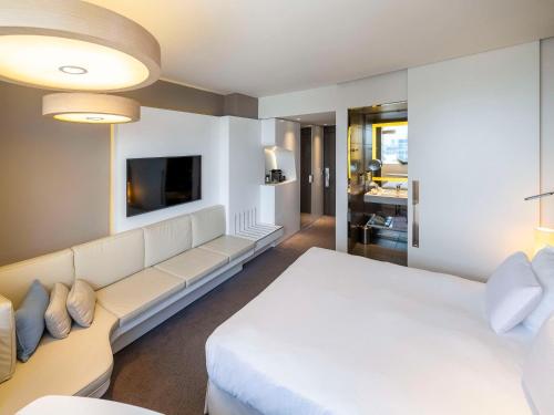 Imagen de la habitación del Hotel Pullman Brussels Centre Midi. Foto 15