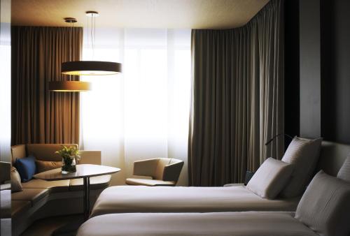 Imagen de la habitación del Hotel Pullman Brussels Midi. Foto 10