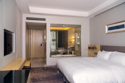 Imagen de la habitación del Hotel Pullman Changshu Leeman. Foto 9