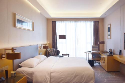 Imagen de la habitación del Hotel Pullman Changshu Leeman. Foto 10