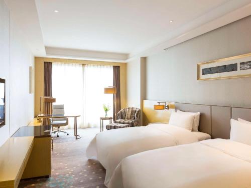 Imagen de la habitación del Hotel Pullman Changshu Leeman. Foto 11