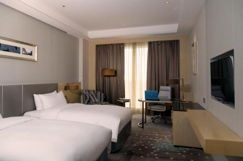 Imagen de la habitación del Hotel Pullman Changshu Leeman. Foto 14