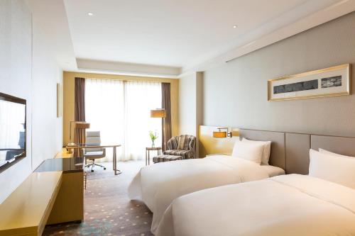 Imagen de la habitación del Hotel Pullman Changshu Leeman. Foto 15