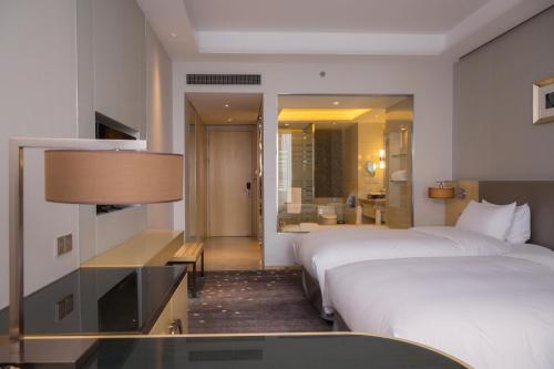 Imagen de la habitación del Hotel Pullman Changshu Leeman. Foto 16