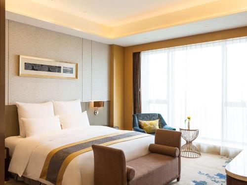 Imagen de la habitación del Hotel Pullman Changshu Leeman. Foto 19